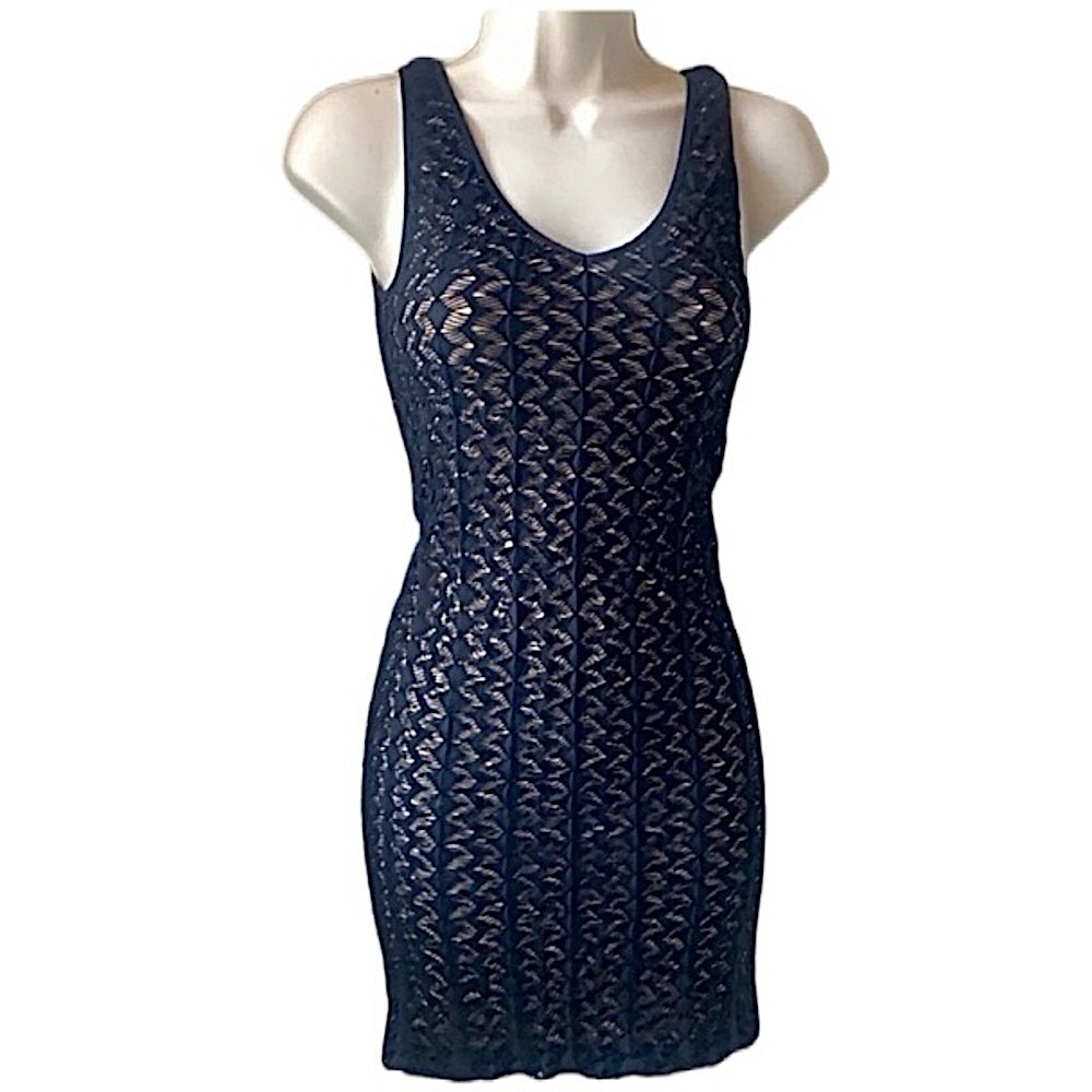 Black BEBE Dress. Nude Spandex lining. Black lace on top. Very stretchy